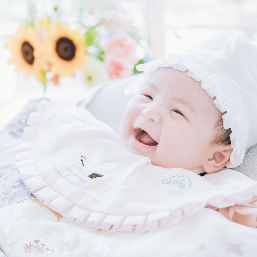 ピンクに花柄の産着